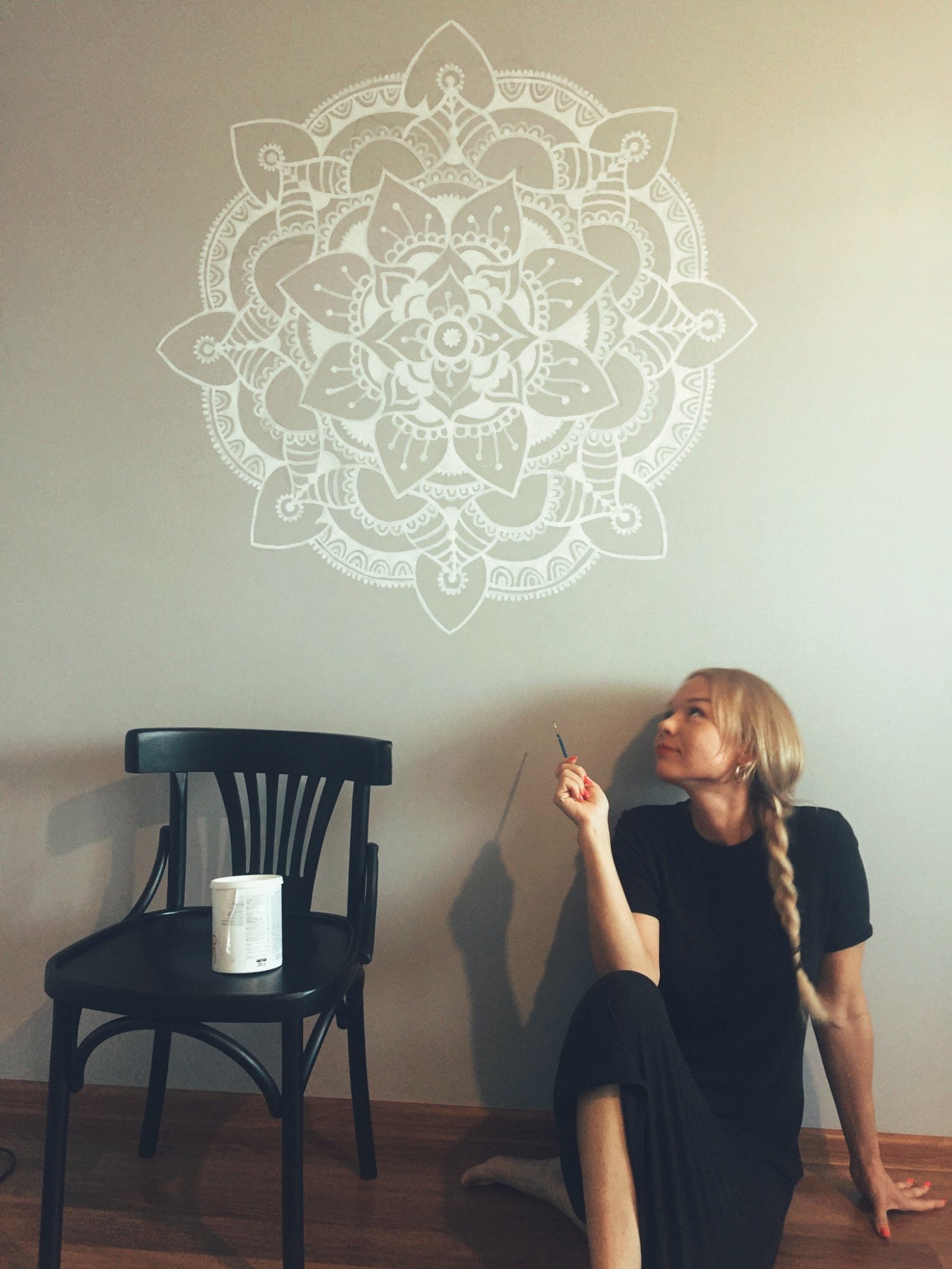 Blue and gold mandala on a dark wall