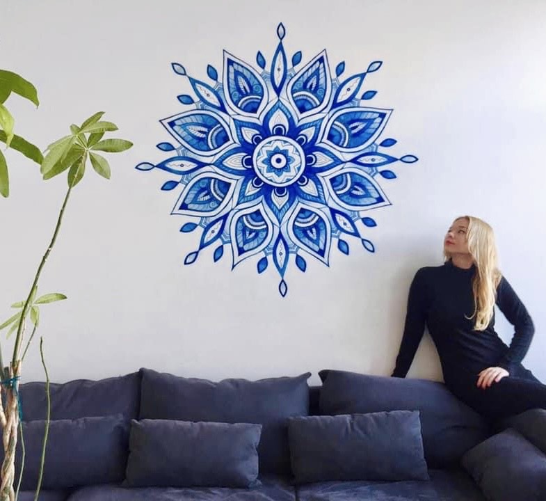 Royal blue mandala above a sofa