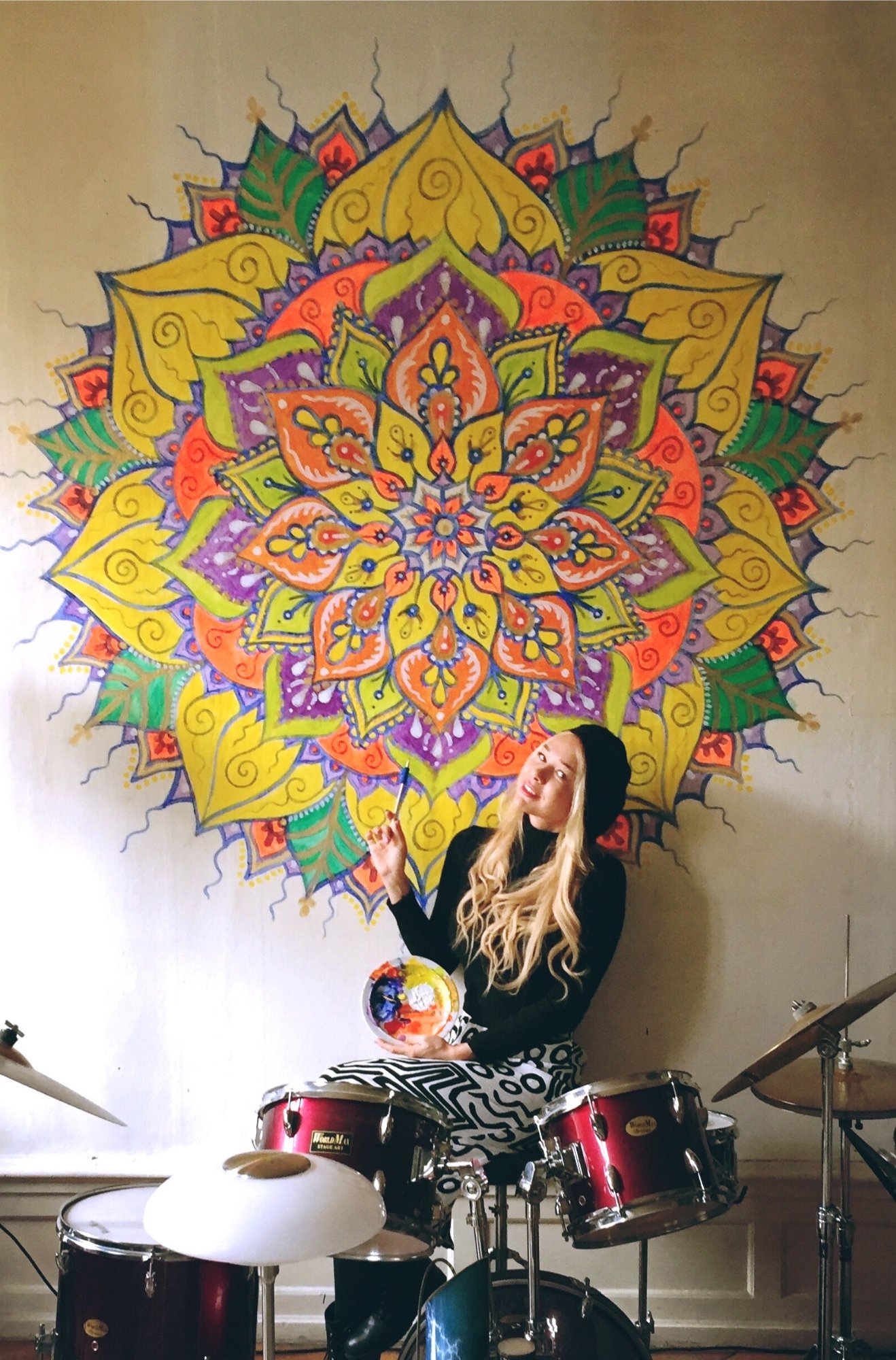 Vibrant full-colour mandala above a drum kit