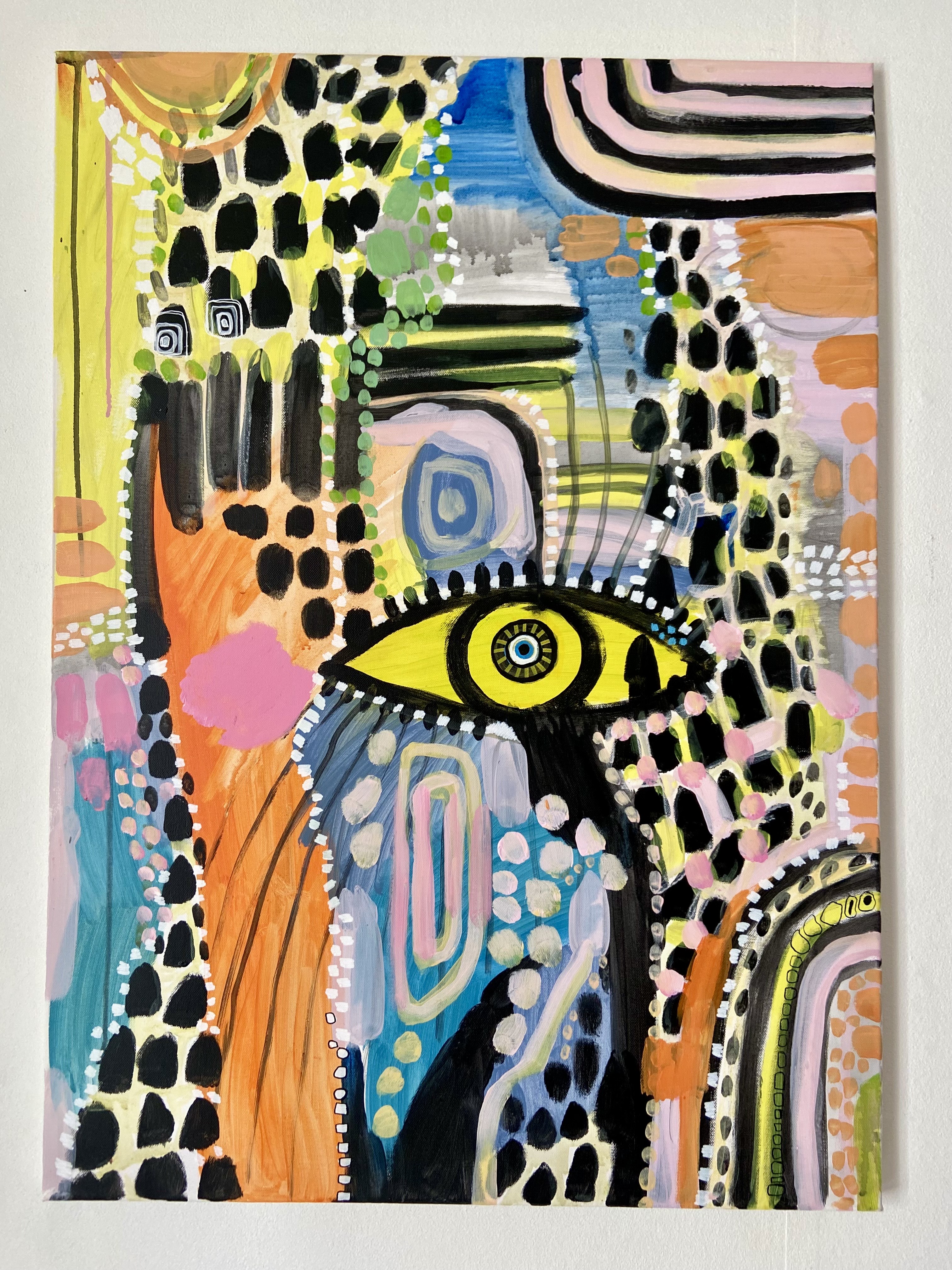 Colourful abstract with yellow eye at centre